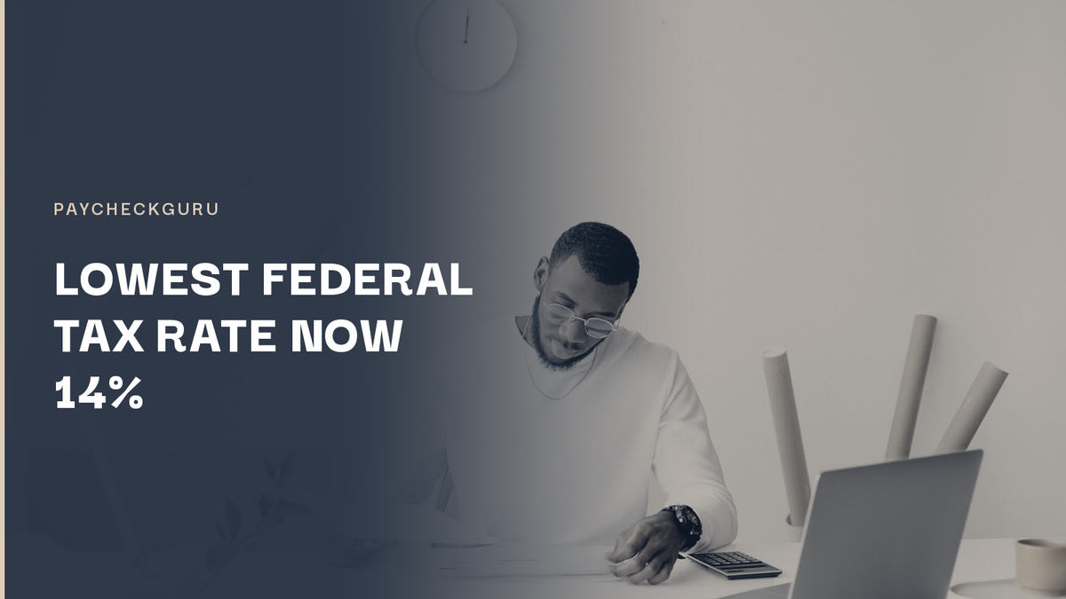 Person working at a desk with a laptop, papers and a lamp, illustrating the 2026 federal tax bracket and indexation update