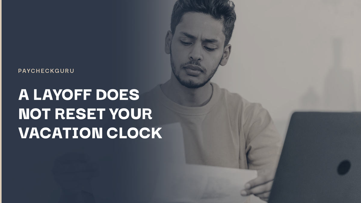 Young man frowning as he reads a sheet of paper beside a laptop, illustrating an Ontario worker checking whether a layoff reset his vacation pay rate